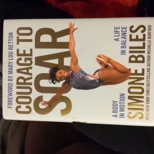 Two gymnastics books- Biles and Moceanu